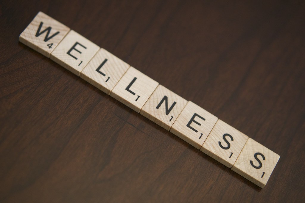 Scrabble letters that read "Wellness"